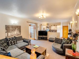 a living room with couches and a table at 1 Bed in Newton Stewart DF198 in Newton Stewart