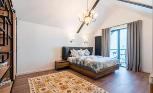 Postel nebo postele na pokoji v ubytování New Gudauri Apartments + 32 fotografií