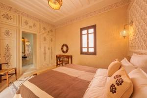 Postel nebo postele na pokoji v ubytování Riad Dar Arwa