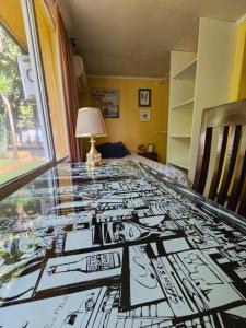 a table with a black and white drawing on it at Hostal Pucara Molina in Molina