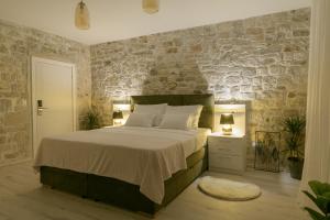 Voodi või voodid majutusasutuse Rooms Bartul Trogir toas