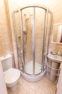 a bathroom with a shower and a toilet and a sink at Luxury Nautical Large Apartment - 2 Bedroom - Whitby Centre - FREE Private Parking in Whitby