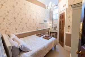 a bedroom with a bed with two teddy bears on it at Luxury Nautical Large Apartment - 2 Bedroom - Whitby Centre - FREE Private Parking in Whitby