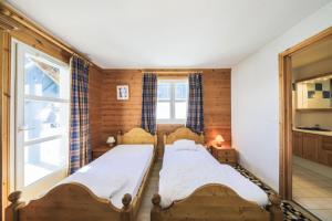 Posteľ alebo postele v izbe v ubytovaní Les Chalets de Flaine Hameau - maeva Home - Chalet Pièces - Sélection 41