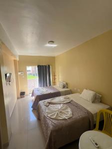Ein Bett oder Betten in einem Zimmer der Unterkunft Pousada sol da manhã maragogi