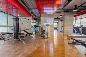 a gym with treadmills and exercise equipment in a building at BHomy Oscar Freire 2 in Sao Paulo