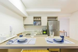 Virtuvė arba virtuvėlė apgyvendinimo įstaigoje BHomy Bela Vista Adaptado e confortável APM1206
