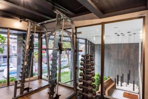 a gym with a bunch of wine racks and windows at BHomy Brooklin - 300m estacão da Brooklin BUR101 in Sao Paulo