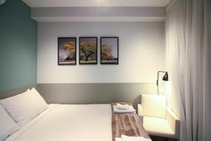 Een bed of bedden in een kamer bij BHomy Brooklin - Com vista p jardim BUR110