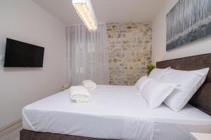 Voodi või voodid majutusasutuse Rooms Bartul Trogir toas