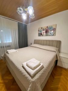 Postel nebo postele na pokoji v ubytování ANA