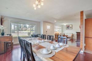 a dining room with a wooden table and chairs at Family-Friendly Renton Retreat 15 Mi to Seattle! in Renton