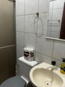 a bathroom with a toilet and a sink at Apto próximo à Polícia Federal in Manaus
