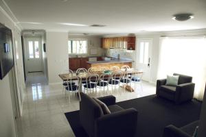 a kitchen and dining room with a table and chairs at Stay Social in Bendigo