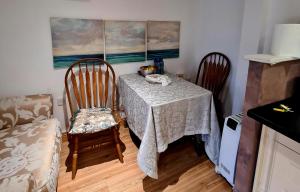 a kitchen with a table and two chairs and a table and a table and chairs at The Lodge in Dublin