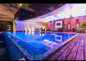 a large swimming pool in front of a building at Guatemala City Getaway in Guatemala