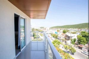 a balcony with a view of a city at Flat 402 in Cabo Frio 700m from the beach in Cabo Frio