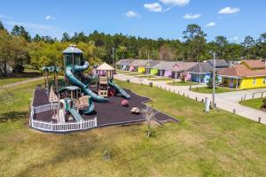 an aerial view of a playground with a slide at Biloxi Resort Cottage with Pool and Lake Access! in Biloxi