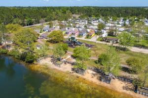 an aerial view of a park next to a river at Biloxi Resort Cottage with Pool and Lake Access! in Biloxi
