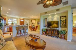 a living room with a couch and a table at Luxury Oasis Palm Villas at Mauna Lani Beach Club in Waikoloa