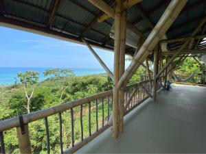 a balcony of a house with a view of the ocean at La Cometa - Palomino in Palomino