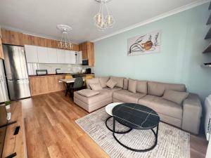 a living room with a couch and a table at Luir's Apartment in Tirana