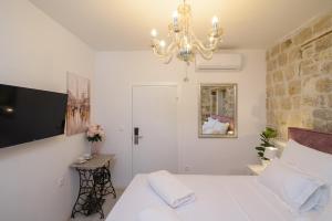 Voodi või voodid majutusasutuse Rooms Bartul Trogir toas