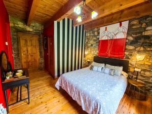 Postel nebo postele na pokoji v ubytování El Molino de la Ropería