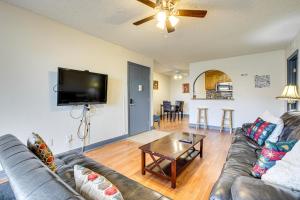 a living room with a couch and a table at WFH-Friendly Las Vegas Condo 2 Mi to Strip! in Las Vegas
