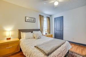 a bedroom with a bed and a blue door at WFH-Friendly Las Vegas Condo 2 Mi to Strip! in Las Vegas