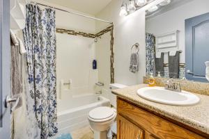 a bathroom with a sink and a toilet and a tub at WFH-Friendly Las Vegas Condo 2 Mi to Strip! in Las Vegas +16 photos