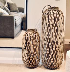 two wicker vases sitting on the floor in a living room at *Luxury Apartment 2min from City in Carlisle