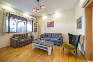 a living room with a couch and a table at Apartments Milunović in Kotor