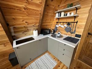 an overhead view of a kitchen in a tiny house at PeaksView Chalets in Žabljak