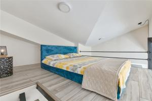 Postel nebo postele na pokoji v ubytování Ell Star 2 Apartment + 12 fotografií