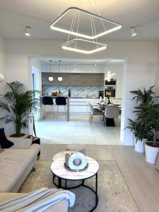 a living room with a couch and a table at Apartment Aria in Lovran