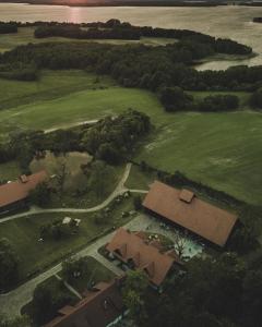 an overhead view of a house in a field at Poganty - Jałownik in Giżycko