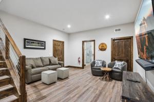 a living room with a couch and two chairs at Mountain View Manor in Banner Elk
