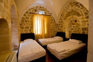 Ένα ή περισσότερα κρεβάτια σε δωμάτιο στο Zinciriye Hotel