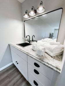 a bathroom with a sink and a mirror at Meadow Room At The Trailblazer Unit 7 in Townsend