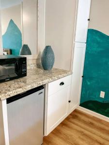 a kitchen with a counter top and a microwave at Mountain Room At The Trailblazer Unit 16 in Townsend