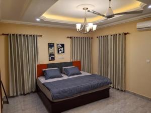 Ein Bett oder Betten in einem Zimmer der Unterkunft Seyramz Palace