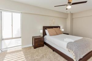 a bedroom with a bed and a ceiling fan at Bargain Memphis apartment w HDTV & WiFi in Memphis