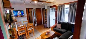 TV a/nebo společenská místnost v ubytování StrandChalet