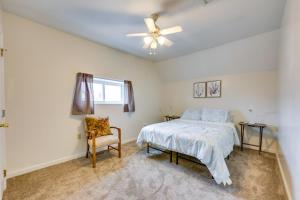 a bedroom with a bed and a ceiling fan at Cozy East Pittsburgh Home - 7 Mi to Frick Park! in East Pittsburgh