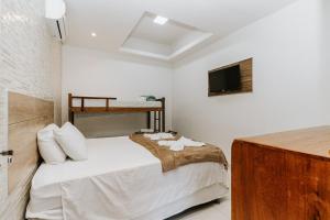 Ένα ή περισσότερα κρεβάτια σε δωμάτιο στο Hotel Fazenda Mirage +16 φωτογραφίες