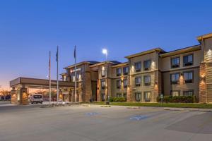 an empty parking lot in front of a building at Best Western Plus Grand Island Inn and Suites in Grand Island