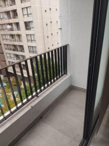 En balkong eller terrasse på Hermoso departamento nuevo en el corazón de Independencia