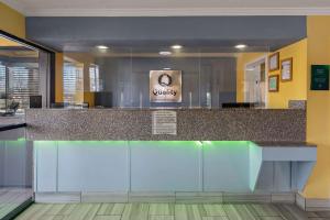 a lobby with a counter with a sign on it at Quality Inn & Suites Dublin in Dublin