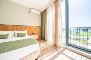 Hotel Millennium by Aycon客房内的一张或多张床位